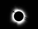 An airplane passes near the total solar eclipse in Bloomington/Reuters